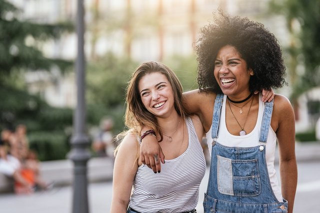 Beautiful women having fun in the street.