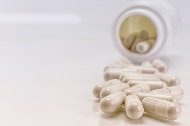 Pills spilling from an open bottle