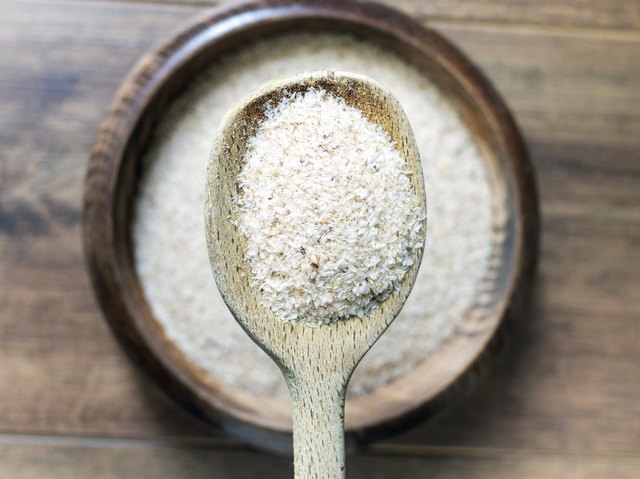 Psyllium husk close up on dark background, top view