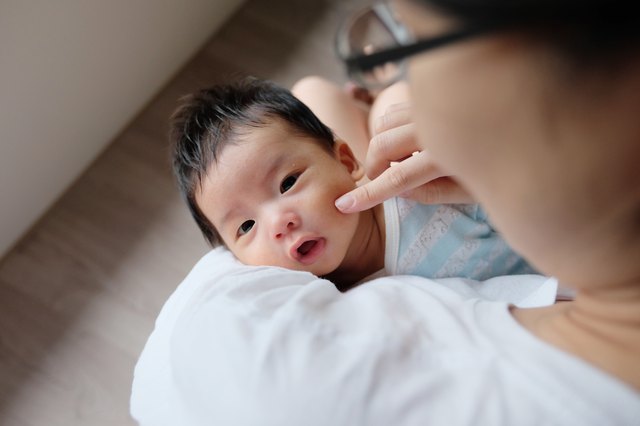 Asian mother comforting baby