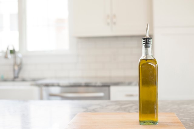Close-Up Of Oil Bottle On Table