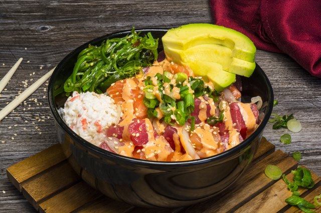 Raw Fish Sushi Pokebowl Meal With Red Napkin
