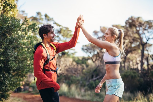 Athletic couple celebrating after the run