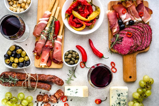 Spanish tapas, traditional food from Spain, wine and appetizers on table, top view