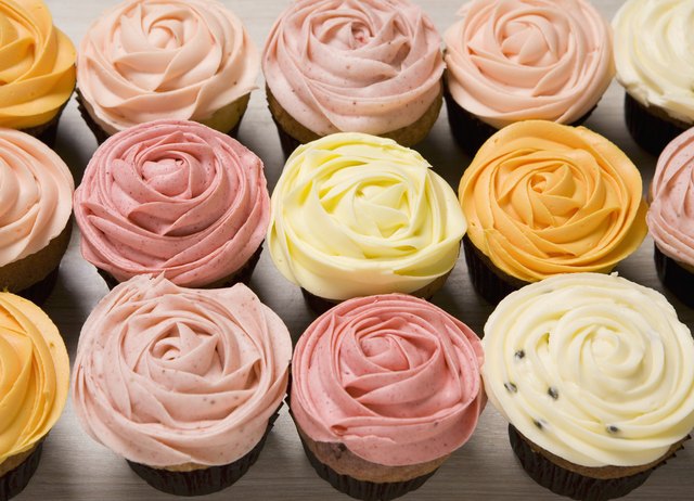 Various coloured rose cupcakes