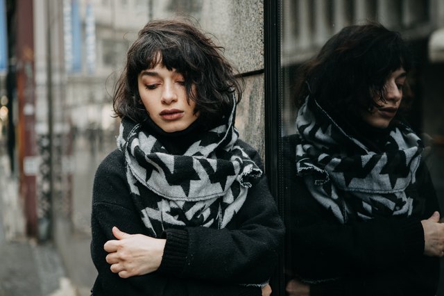 Portrait of a girl outdoors on a cold and gloomy day