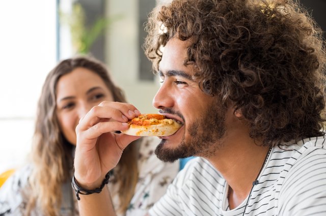 The Bizarre Reason Men Eat More Around Women | Livestrong.com