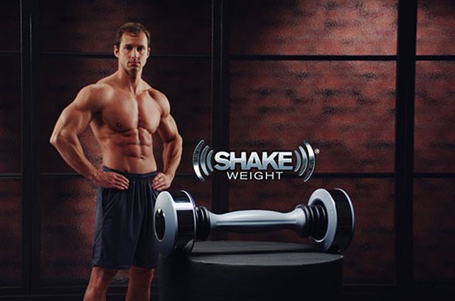 Portrait of man using exercise equipment in gymnasium