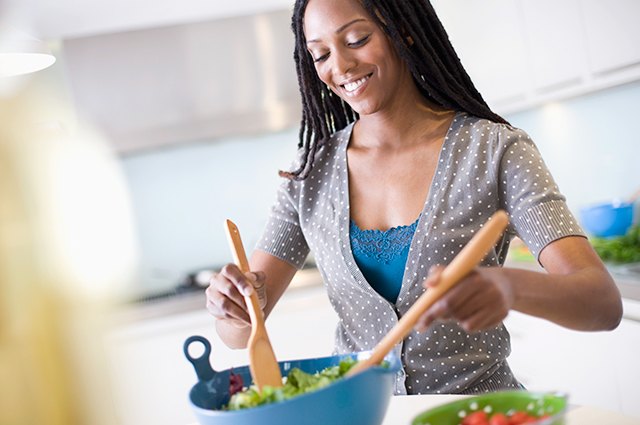 woman making salad in the kitchen