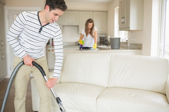 Couple cleaning the house