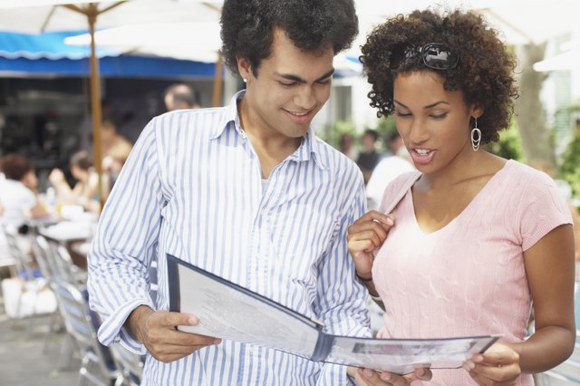Young couple examining a menu
