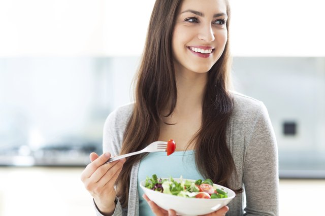 Woman eating salad