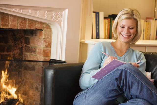 Woman writing in journal