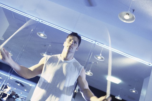 Low angle view of a young man jumping rope