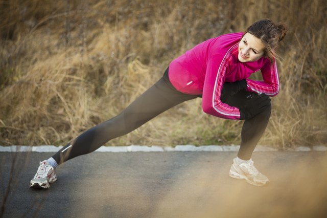 Young woman stretching before her run