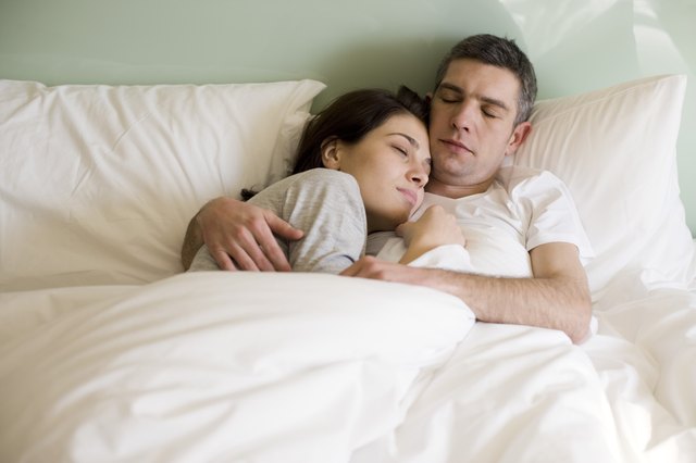 Couple sleeping in bed