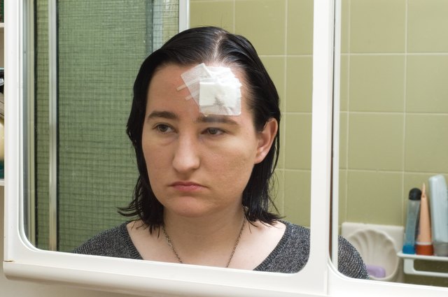 Young Woman Checks Her Injury