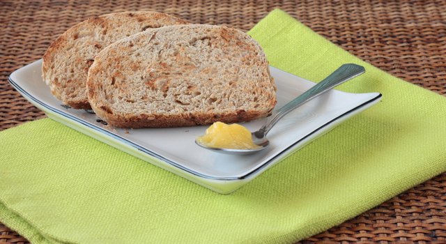 Sliced wholemeal bread with seeds and ghee (clarified butter)