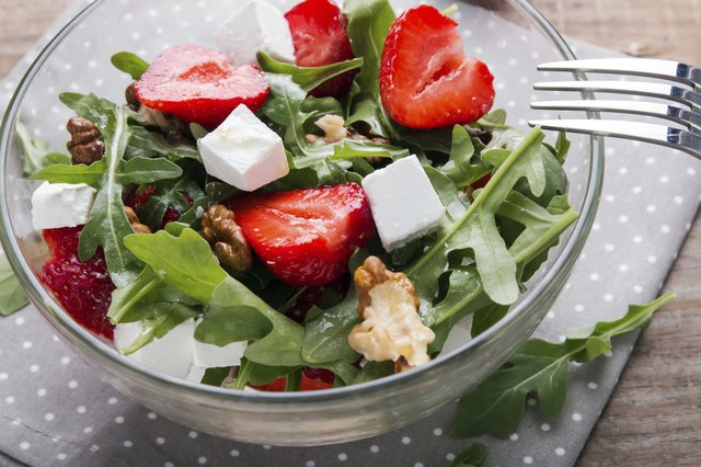 Healthy salad on the wooden table close-up