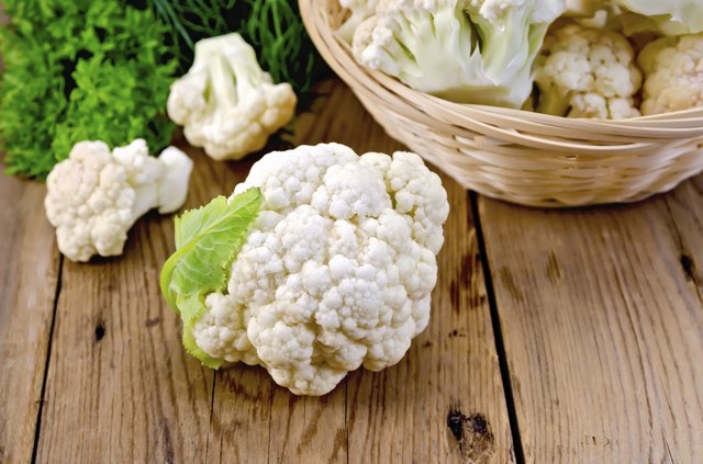 Cauliflower with a basket on the board