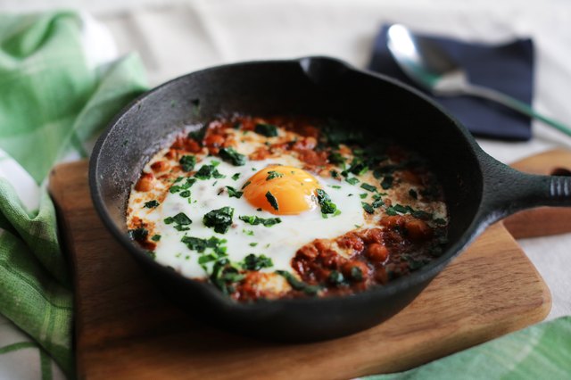 Poached egg in tomato sauce, paprika and spices, arabic shakshouka
