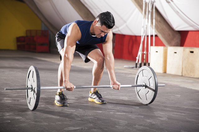 Young man lifting weights