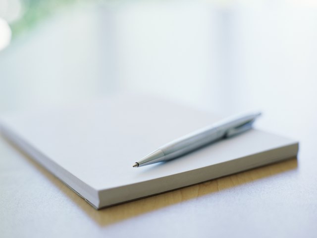 close-up of a pen on a notebook