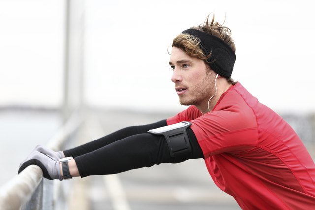 Male runner stretching