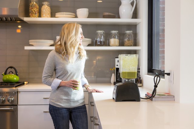 A mom making a healthy smoothie.