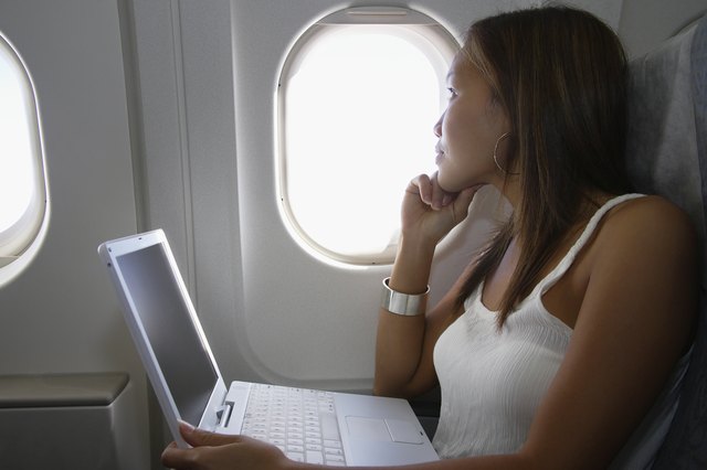 Traveling Woman on a Laptop