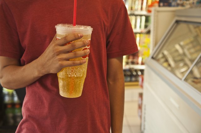Caucasian man holding soda