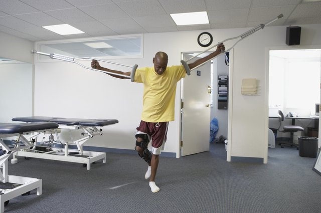 Patient standing on his one leg holding a crutch