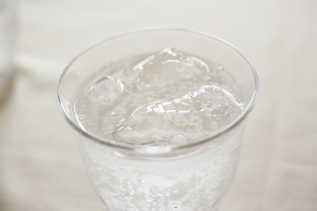 Glass of soda on table, close up