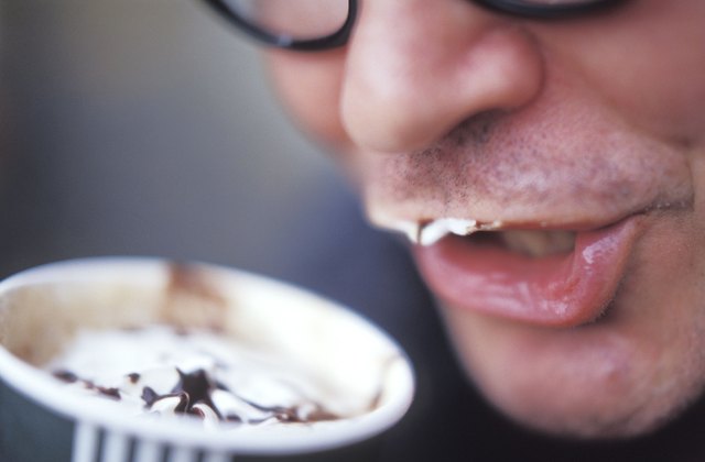 Man Drinking a Creamy Coffee Drink