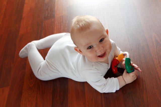 Baby boy with his first toys