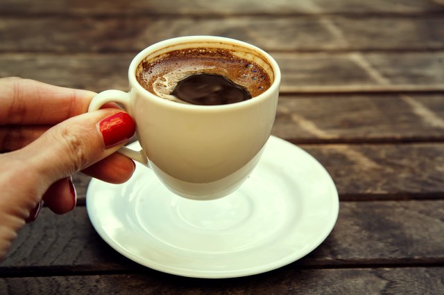 woman's hand holding cup of Turkish coffee "espresso" Istanbul, Turkey