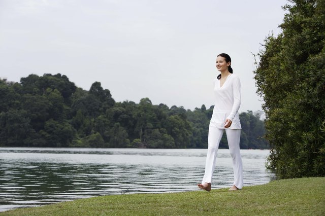 Woman walking by lake