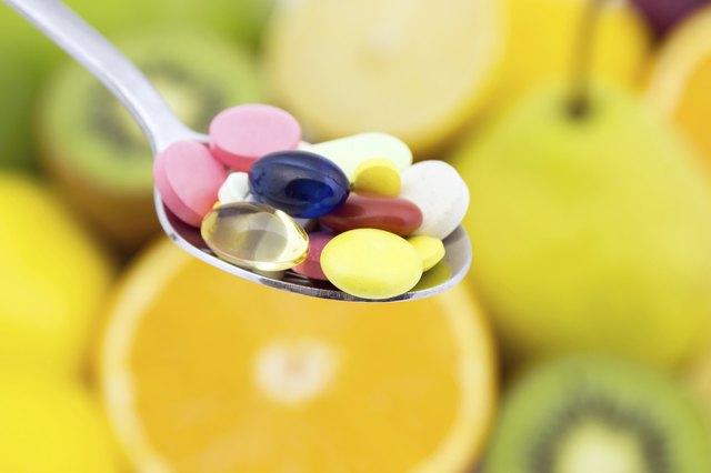 Spoon full of colorful pills