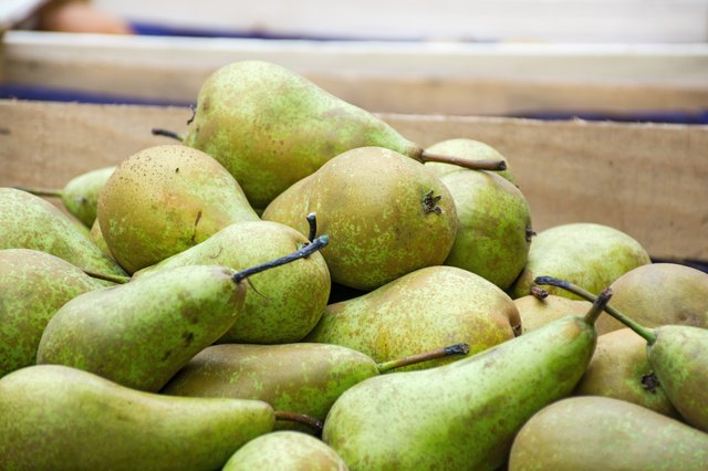 bio pears in a wooden box at the farmers market