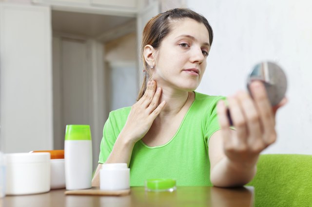 woman stares on her neck