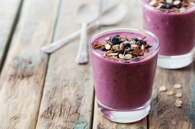 Smoothie, yogurt, milkshake with frozen berry, oats decorated grated chocolate