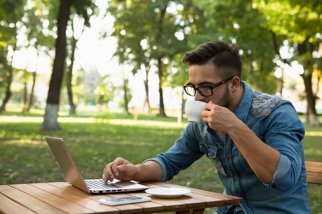 Freelancer hipster man drinking coffee