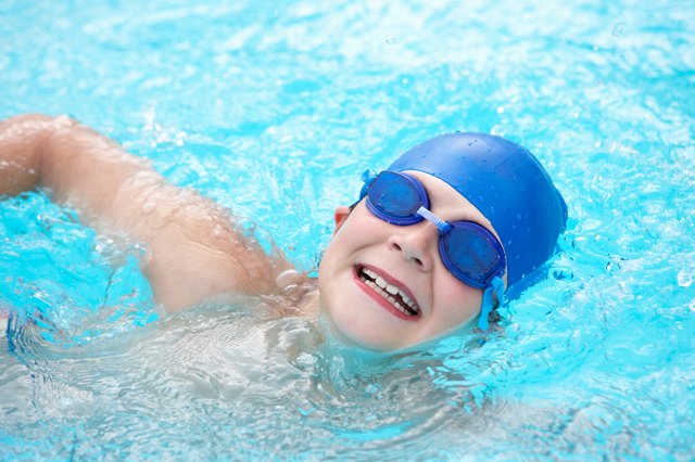 Boy swimming in outdoor pool