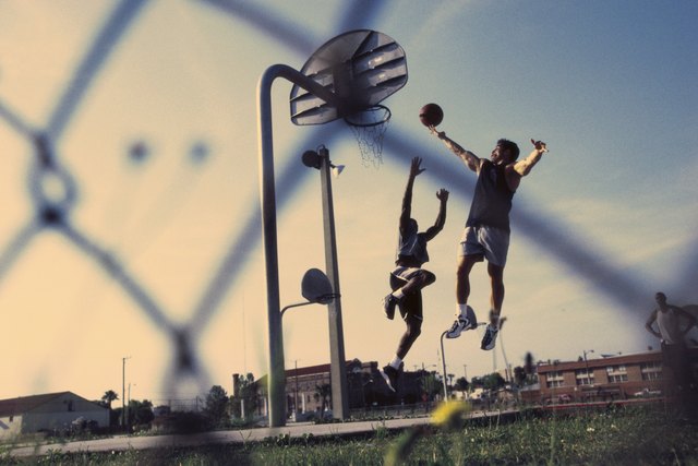 Low angle view of two men playing basketball