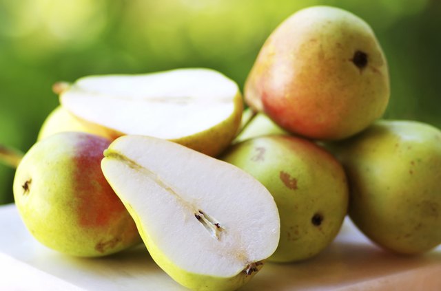 Ripe pears on table