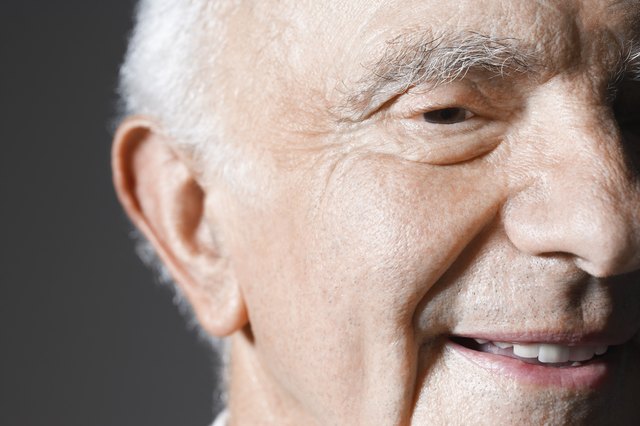 Senior man in studio, close up