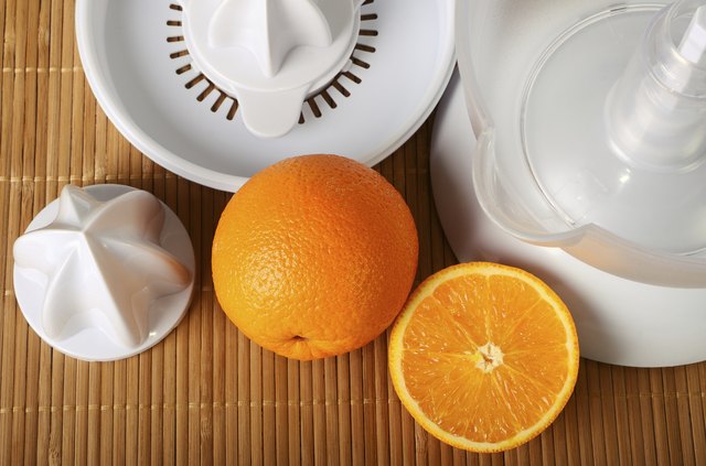 Fruit juicer and oranges