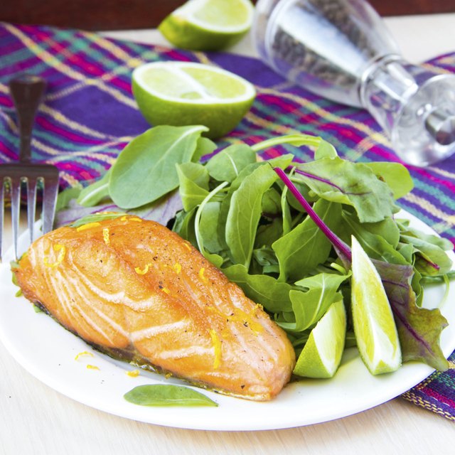 Grilled fillet red salmon and salad with lettuce, lime