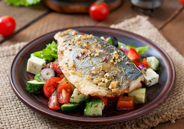 Baked seabass with Greek salad