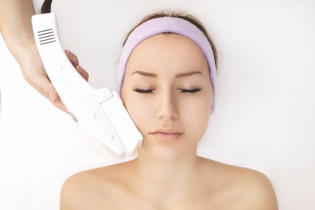 Young woman receiving laser therapy